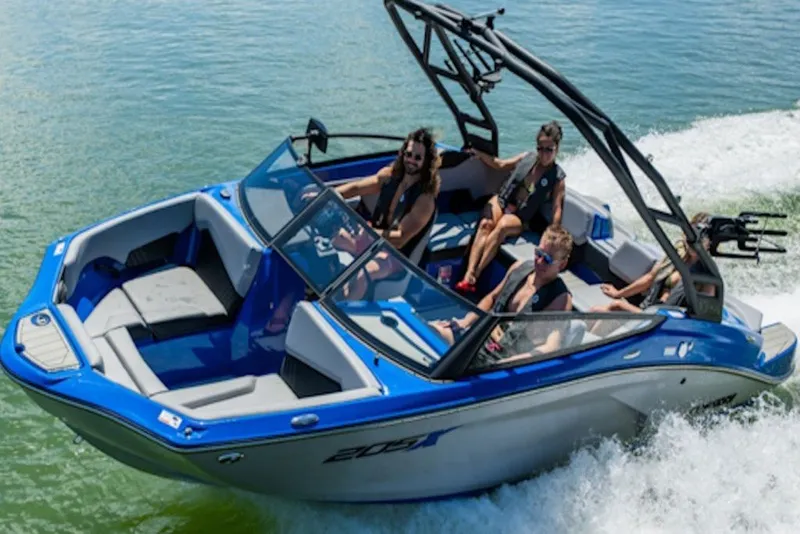 Slide: The Image of 2027 Yamaha Boats 205XD cruising on water with passengers enjoying the ride. - 3