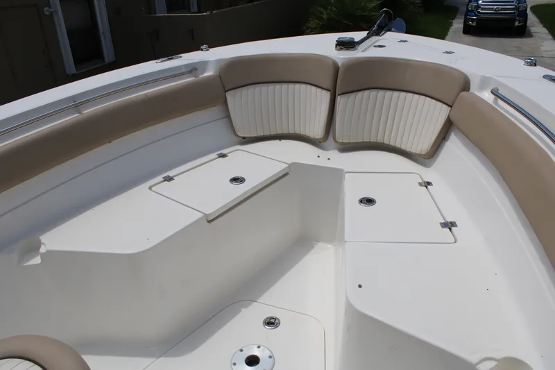 Slide: The Image of Interior view of 2016 Sea Fox 288 Commander boat with cushioned seating and storage compartments. - 8