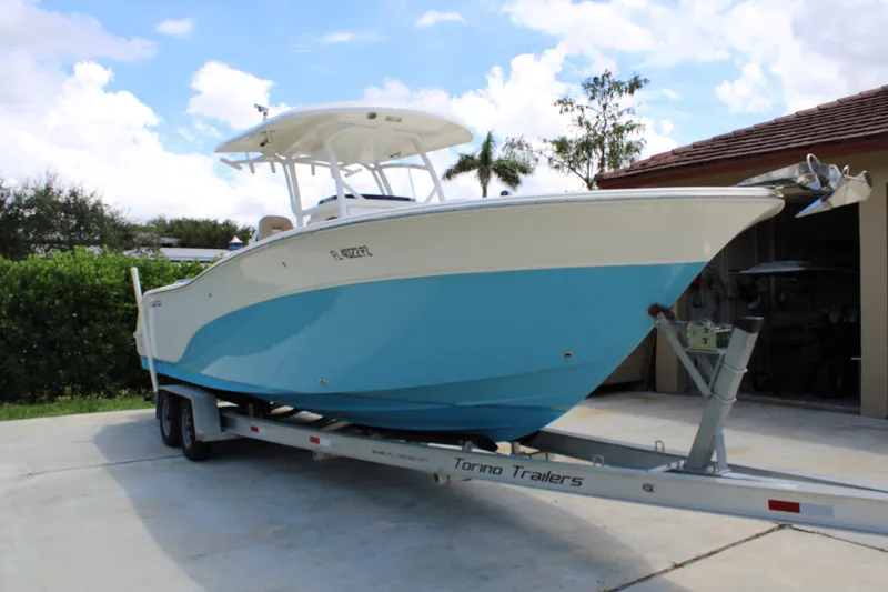 Slide: The Image of 2016 Sea Fox 288 Commander boat on trailer, parked outdoors. - 7