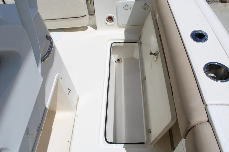 Slide: The Image of Open storage compartment on a 2016 Sea Fox 288 Commander boat deck. - 33