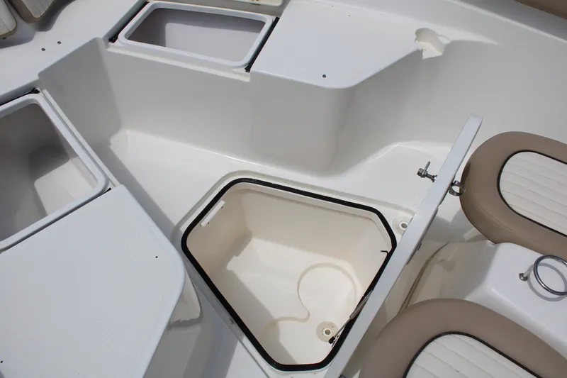Slide: The Image of 2016 Sea Fox 288 Commander boat storage compartments and seating area. - 11