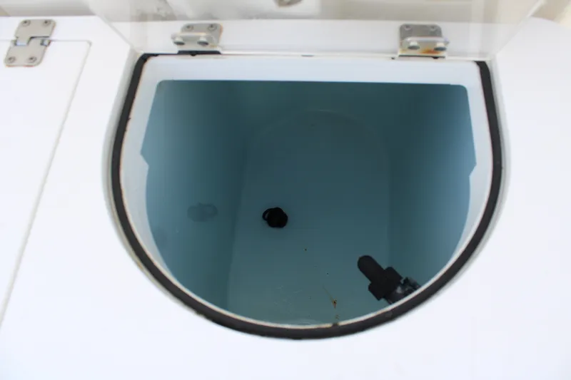 Slide: The Image of Livewell compartment on a 2016 Sea Fox 288 Commander boat, open and empty. - 28