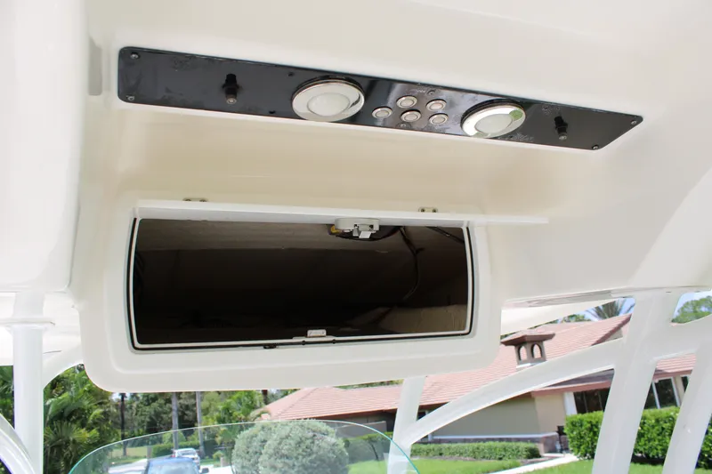 Slide: The Image of 2016 Sea Fox 288 Commander boat console storage compartment with control panel. - 18