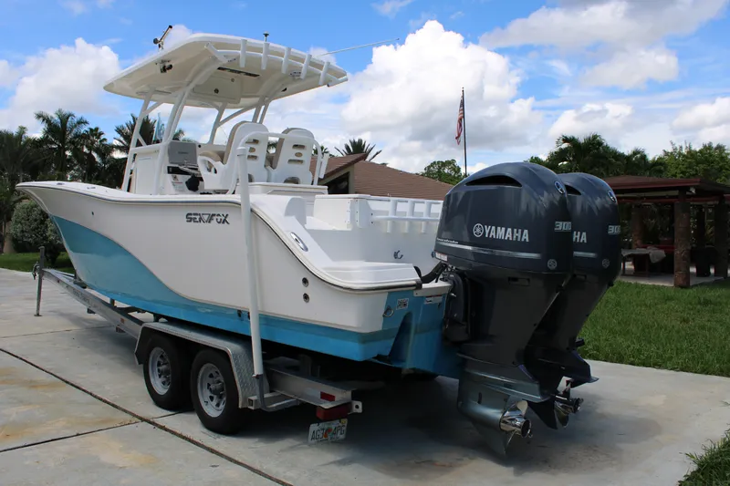 Slide: The Image of 2016 Sea Fox 288 Commander boat with dual Yamaha engines on a trailer. - 3