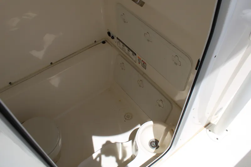 Slide: The Image of Interior of 2016 Sea Fox 288 Commander boat's compact bathroom area. - 17