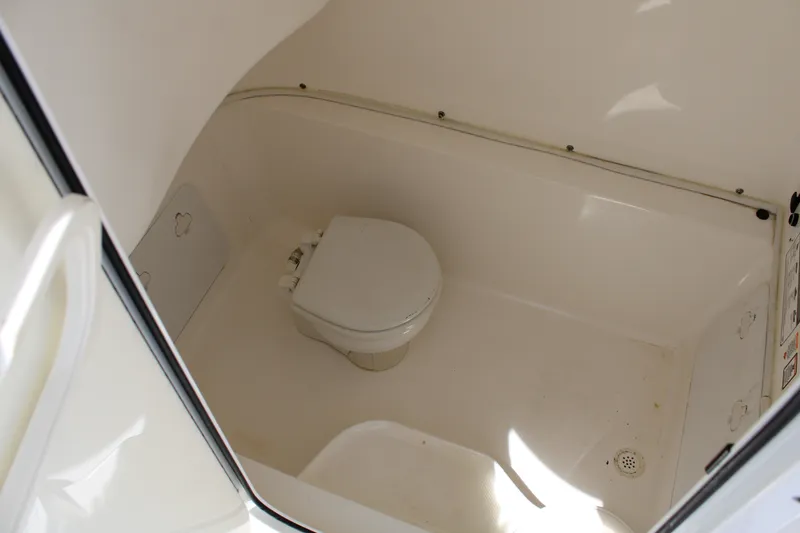 Slide: The Image of Interior view of 2016 Sea Fox 288 Commander boat's compact bathroom area. - 16