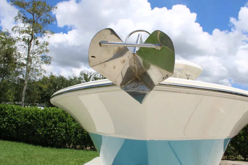 Slide: The Image of 2016 Sea Fox 288 Commander boat with anchor, under a partly cloudy sky. - 43