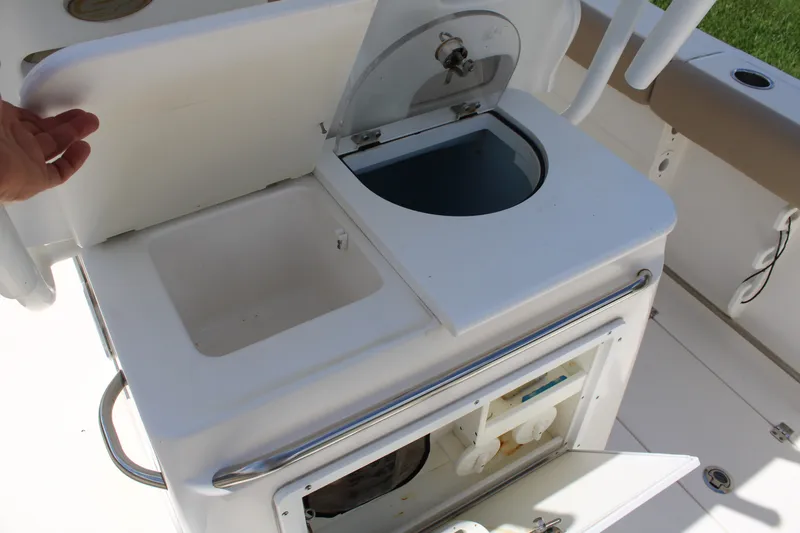 Slide: The Image of 2016 Sea Fox 288 Commander boat with open storage compartments and sink. - 26