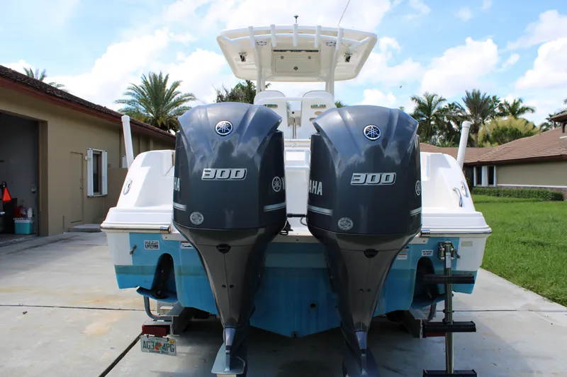 Slide: The Image of 2016 Sea Fox 288 Commander with dual Yamaha 300 engines, parked outdoors. - 4