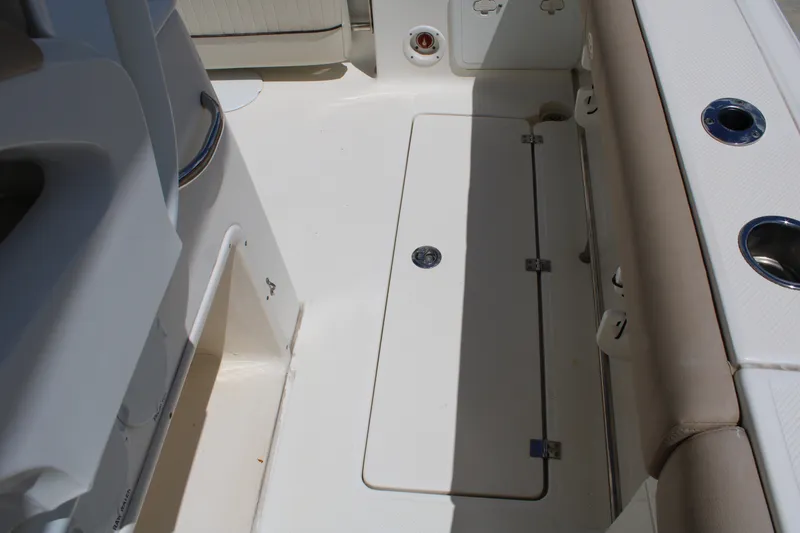 Slide: The Image of 2016 Sea Fox 288 Commander boat deck with storage compartment and seating. - 32