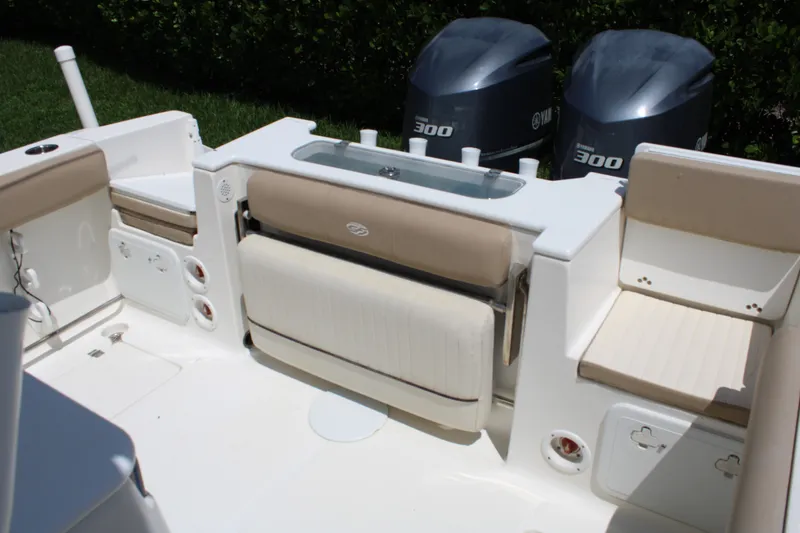 Slide: The Image of 2016 Sea Fox 288 Commander boat interior with Yamaha 300 engines, featuring seating and storage. - 24