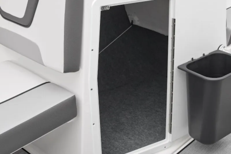 Slide: The Image of Interior view of 2027 Yamaha Boats SX220, featuring seating and storage area. - 2