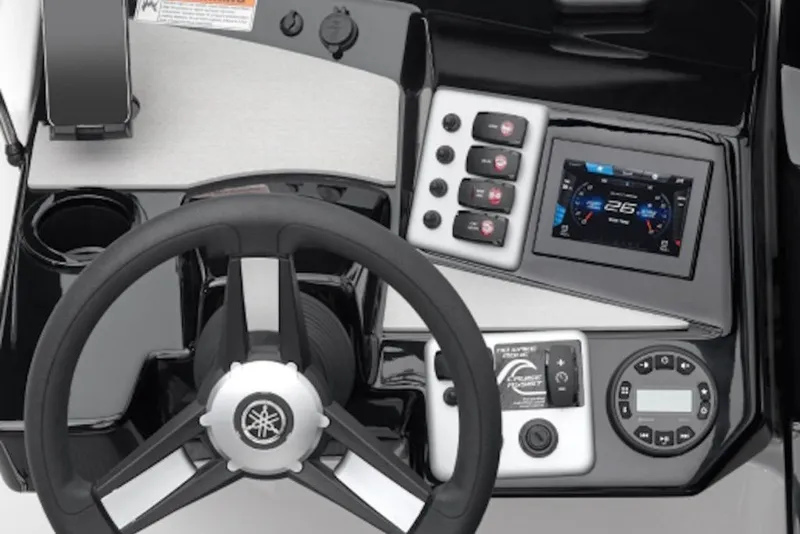 Slide: The Image of 2027 Yamaha Boats SX220 dashboard with steering wheel, digital display, and control panel. - 5