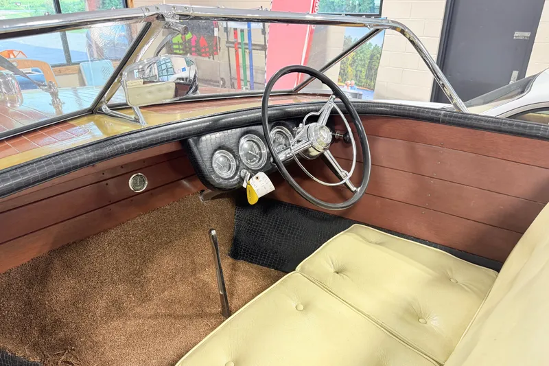 Slide: The Image of 1955 Chris Craft Chriscraft boat interior with vintage steering wheel and dashboard. - 5