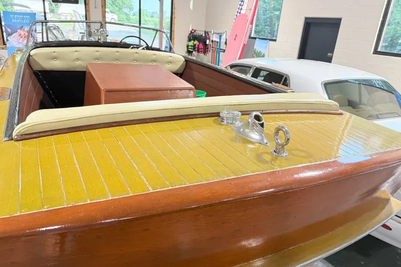 Slide: The Image of 1955 Chris Craft Chriscraft boat interior with polished wood and vintage design elements. - 9
