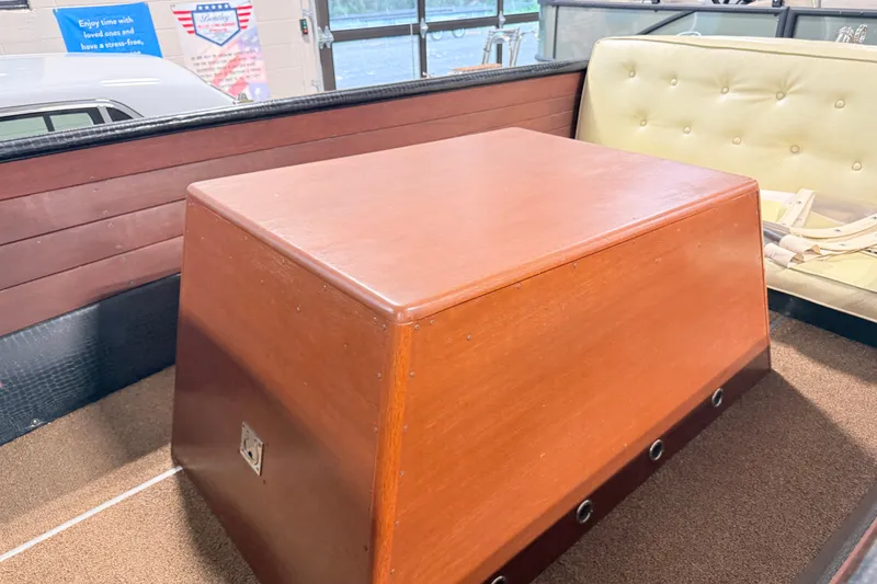 Slide: The Image of 1955 Chris Craft Chriscraft interior with wooden paneling and cushioned seating. - 6