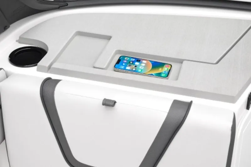 Slide: The Image of Interior of 2027 Yamaha Boats 220 AR with smartphone holder and cup holder. - 3