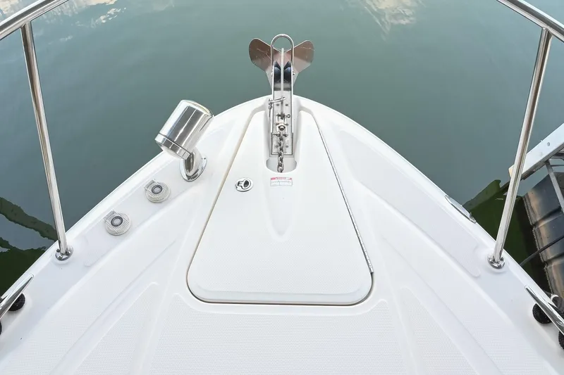 Slide: The Image of Bow of 2011 Sea Ray Sundancer 330 with anchor and railing, docked on calm water. - 28