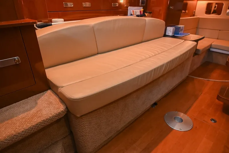 Slide: The Image of Interior of 2011 Sea Ray Sundancer 330 with beige seating and wooden flooring. - 38