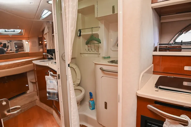 Slide: The Image of Interior of 2011 Sea Ray Sundancer 330 yacht showing bathroom and kitchenette area. - 48