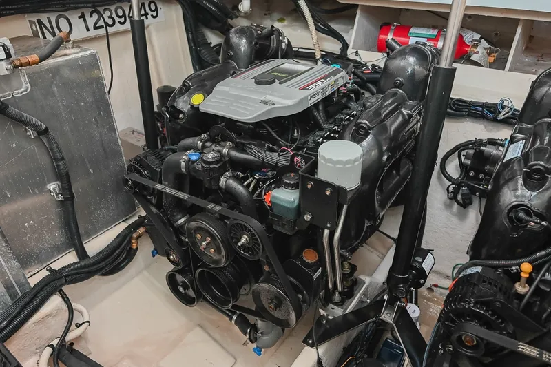Slide: The Image of Engine compartment of a 2011 Sea Ray Sundancer 330 boat, showcasing detailed machinery. - 53