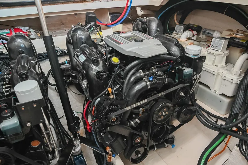 Slide: The Image of Engine room of 2011 Sea Ray Sundancer 330 with visible components and wiring. - 54