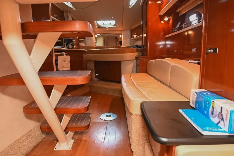 Slide: The Image of Interior of 2011 Sea Ray Sundancer 330 yacht with wooden stairs and leather seating. - 47