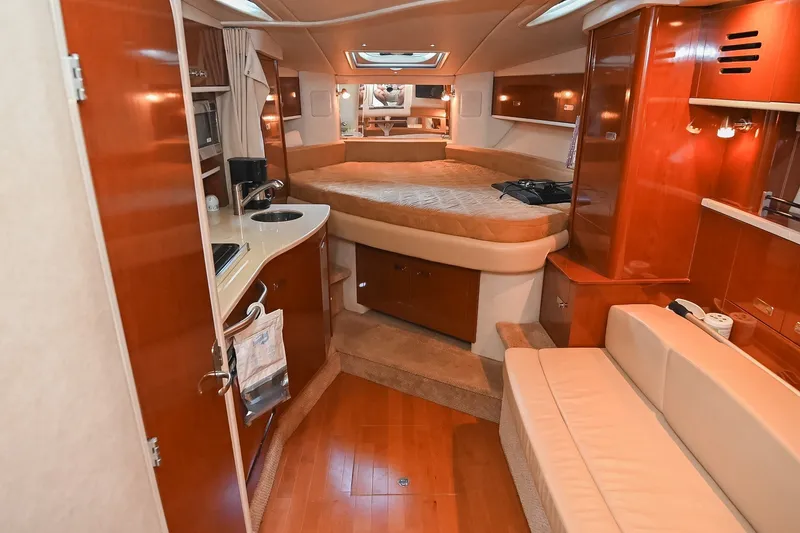 Slide: The Image of Luxurious interior of 2011 Sea Ray Sundancer 330 yacht with cozy bed and kitchenette. - 30