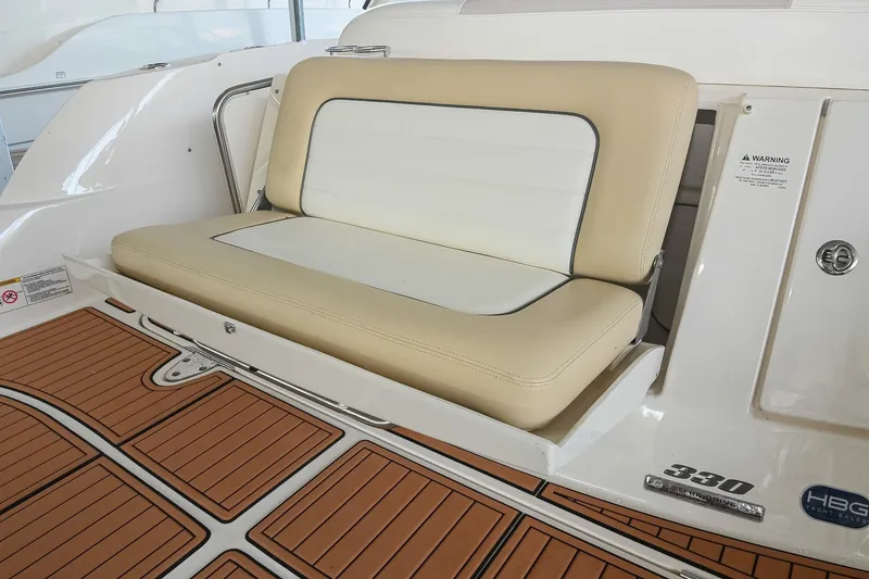 Slide: The Image of 2011 Sea Ray Sundancer 330 boat seat with teak-style flooring. - 8