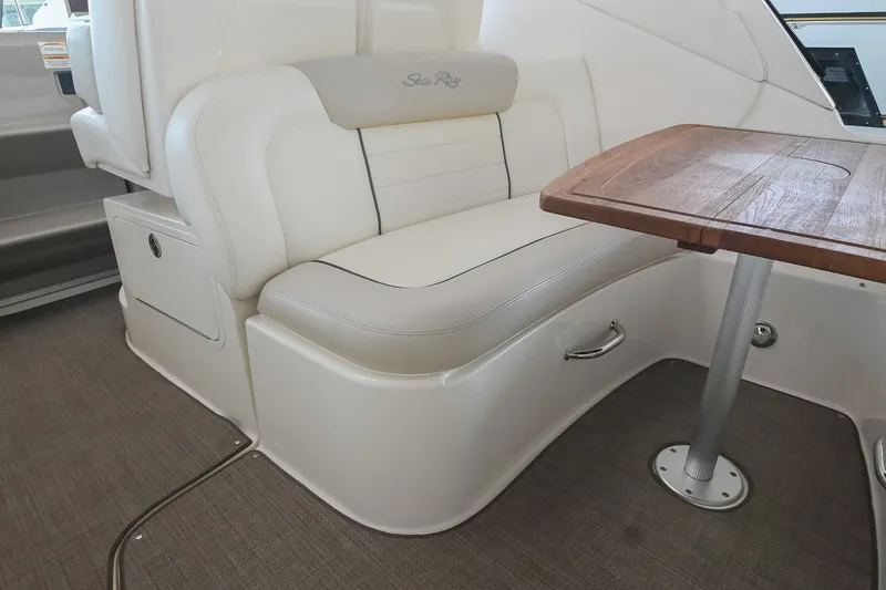 Slide: The Image of Luxurious interior seating of 2011 Sea Ray Sundancer 330 with elegant wooden table. - 11