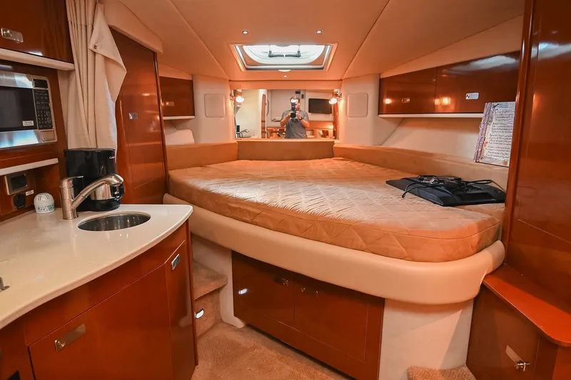 Slide: The Image of Luxurious interior of 2011 Sea Ray Sundancer 330 yacht with cozy bed and kitchenette. - 39