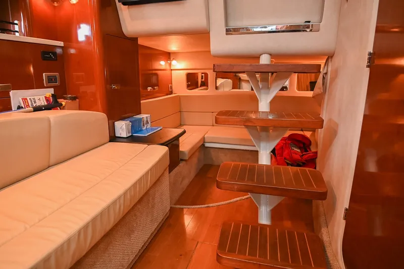 Slide: The Image of Luxurious interior of 2011 Sea Ray Sundancer 330 yacht with wooden steps and beige seating. - 43