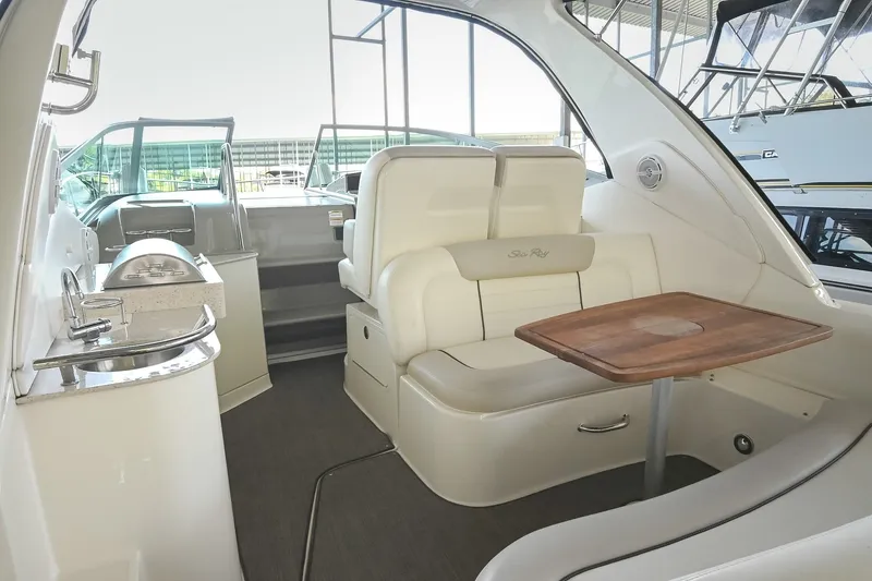 Slide: The Image of Interior of 2011 Sea Ray Sundancer 330 yacht with seating and table. - 9