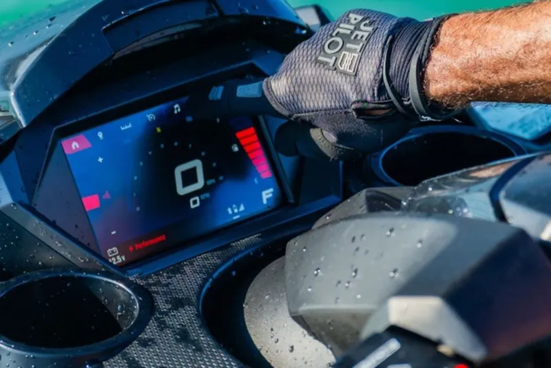 Slide: The Image of 2027 Yamaha WaveRunner FX Limited SVHO dashboard with digital display and gloved hand. - 5
