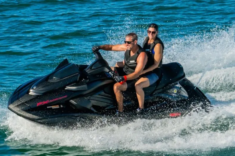 Slide: The Image of Two people riding a 2027 Yamaha WaveRunner FX Limited SVHO on the water. - 3