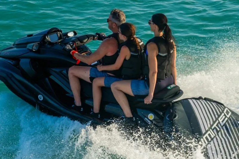 Slide: The Image of Three people riding a 2027 Yamaha WaveRunner FX Limited SVHO on the ocean. - 2