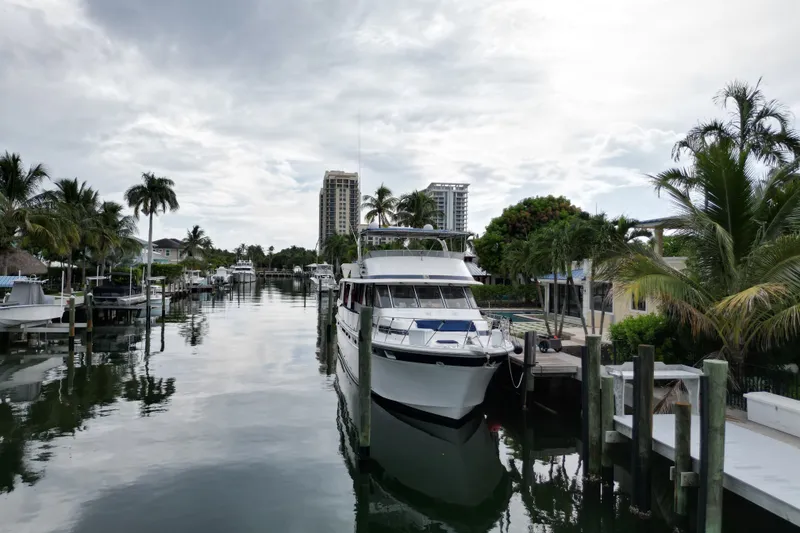 Slide: The Image of 1988 Jefferson Marquessa 60 MY yacht docked in a scenic canal with palm trees. - 6