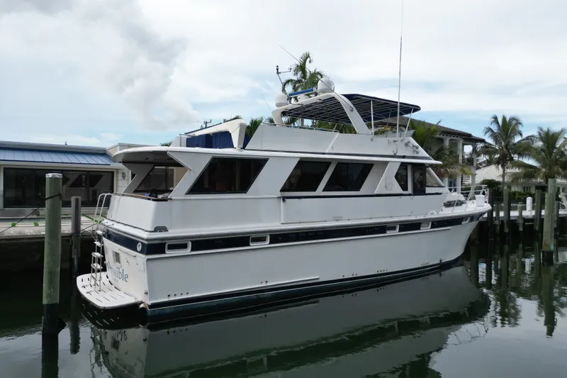 Slide: The Image of 1988 Jefferson Marquessa 60 MY yacht docked at marina, palm trees in background. - 3