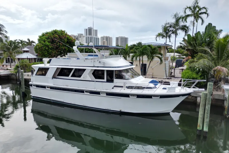 Slide: The Image of 1988 Jefferson Marquessa 60 MY yacht docked near palm trees and buildings. - 1