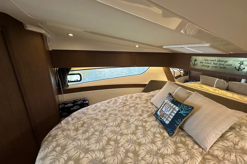 Slide: The Image of Luxurious bedroom interior of 2024 Beneteau Antares 11 Fly yacht with decorative pillows. - 88