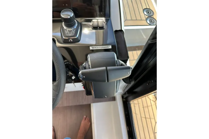 Slide: The Image of Control panel of 2024 Beneteau Antares 11 Fly boat, featuring joystick and throttle. - 35