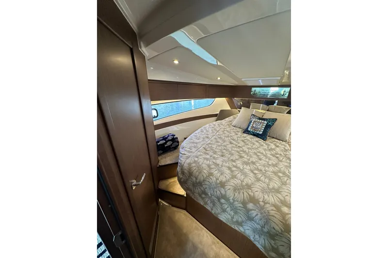 Slide: The Image of Luxurious cabin interior of 2024 Beneteau Antares 11 Fly with elegant bedding and wood finishes. - 86