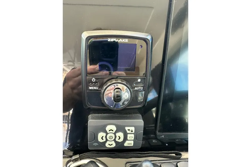 Slide: The Image of Control panel on 2024 Beneteau Antares 11 Fly boat, featuring Zipwake system. - 33
