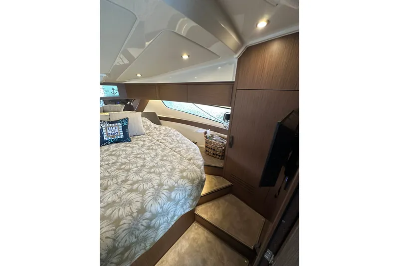 Slide: The Image of Luxurious cabin interior of 2024 Beneteau Antares 11 Fly with cozy bedding and modern lighting. - 85