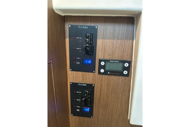 Slide: The Image of Control panel of 2024 Beneteau Antares 11 Fly with digital displays and switches. - 77