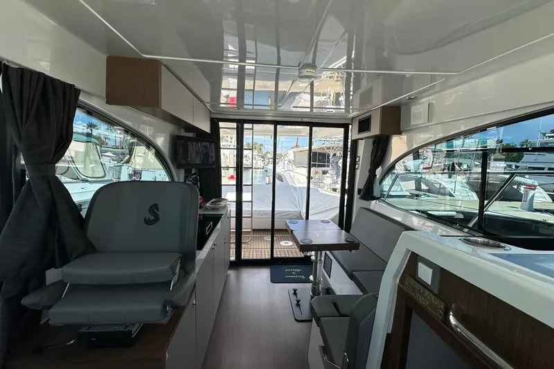 Slide: The Image of Interior of 2024 Beneteau Antares 11 Fly yacht, featuring modern seating and sleek design. - 72
