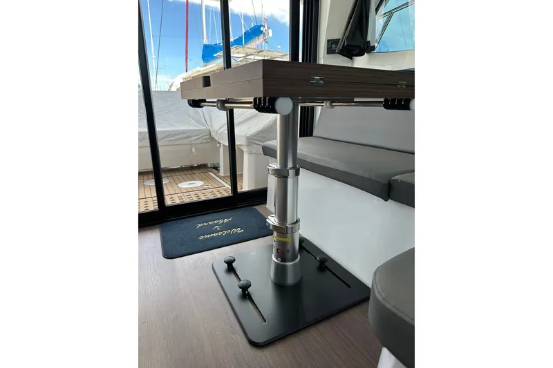Slide: The Image of Interior of 2024 Beneteau Antares 11 Fly, featuring adjustable table and seating. - 68