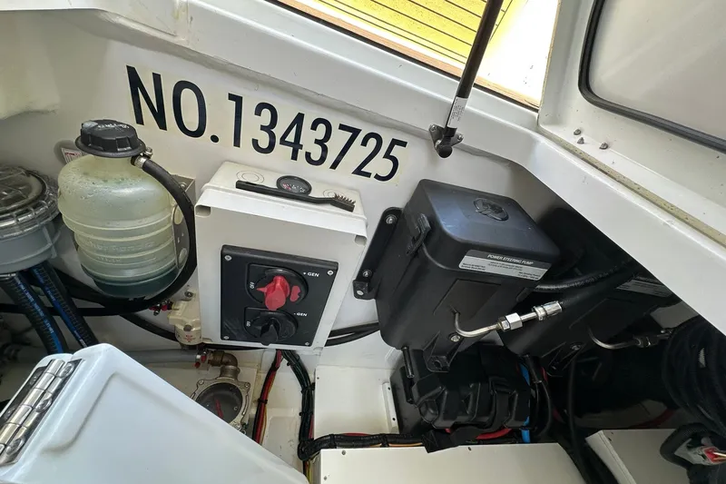Slide: The Image of Engine compartment of 2024 Beneteau Antares 11 Fly with equipment and serial number. - 50