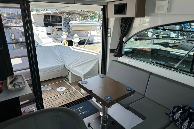 Slide: The Image of Interior view of 2024 Beneteau Antares 11 Fly yacht, featuring seating and table. - 66