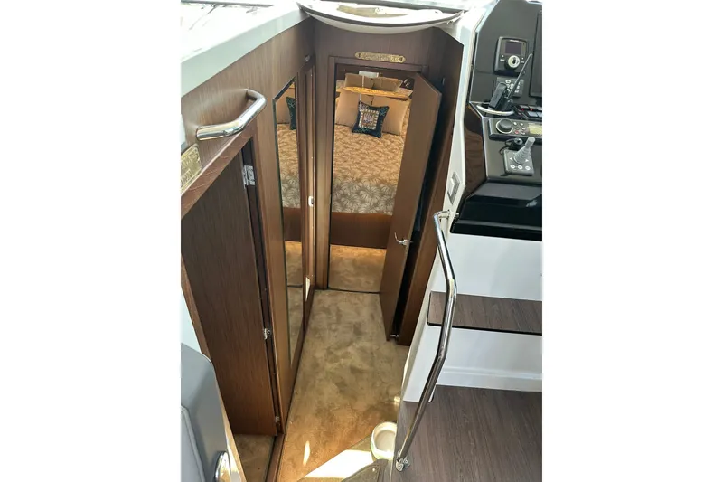 Slide: The Image of Interior view of 2024 Beneteau Antares 11 Fly, featuring cabin entrance and helm controls. - 71